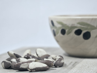 Brazil nuts in front of a bowl