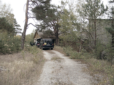 Two cars on a dirt road in the inner exclusion zone