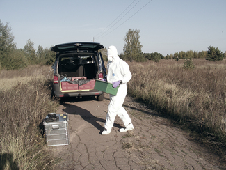 The box with a soil sample is carried to the car (choosen image)