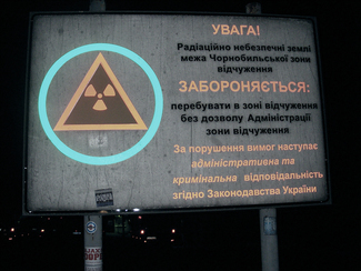 Warning sign at the entrance to the 30-kilometre-zone around the Chernobyl nuclear power plant (show image)